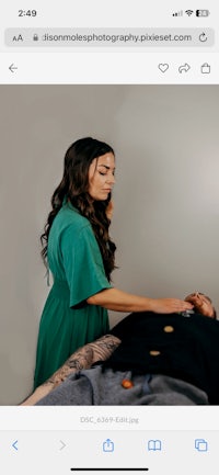 a woman is laying on a man's back